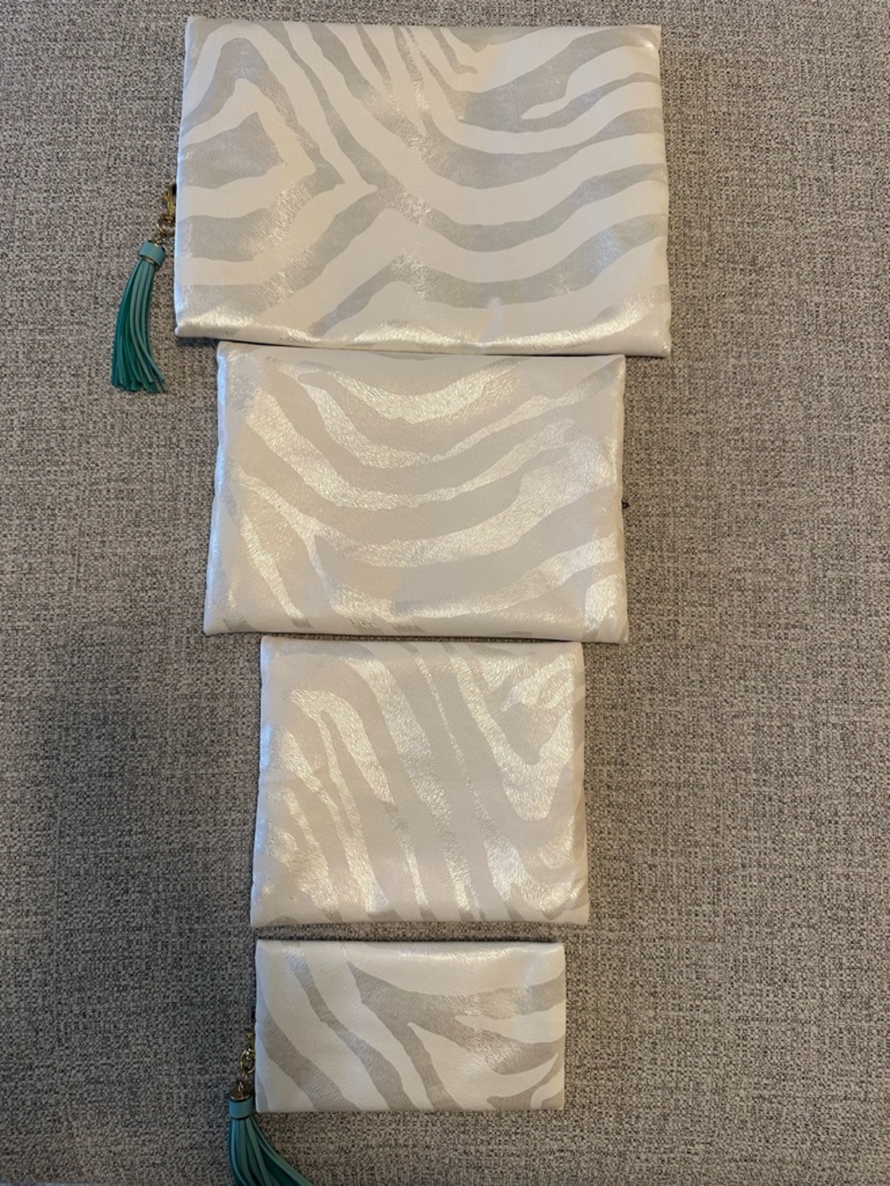 Makeup Junkie Set of 4 White Shimmer Zebra Print Pouches with Teal Tassels - Picture 2 of 10